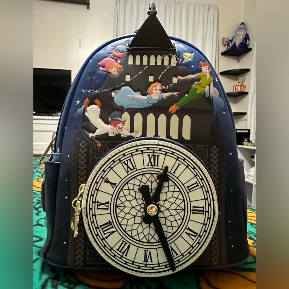 Lounge fly Peter Pan, backpack, and wallet.